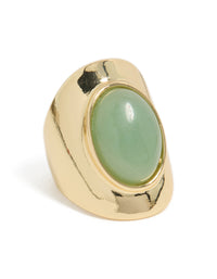 Showcasing a gold plated ring featuring an oval pale green semi precious stone side detail view - link has visual effect only
