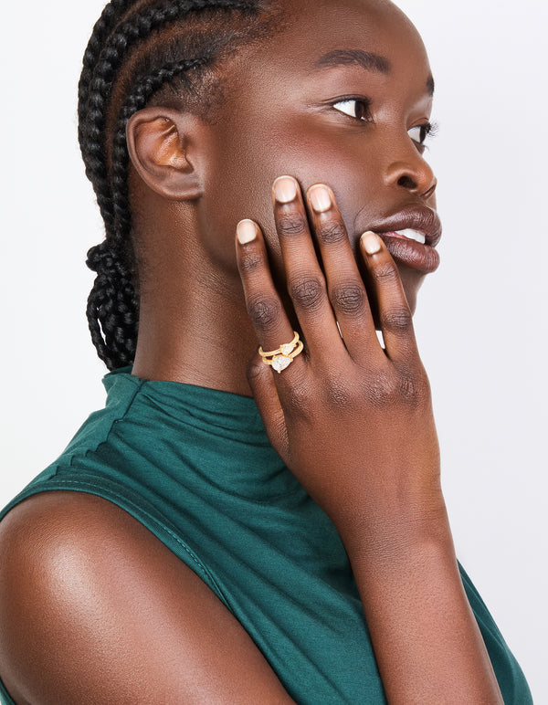 Featuring a gold plated double cubic zirconia split ring on finger view