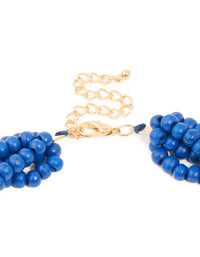 Shop dark blue acrylic beaded long layered necklace with royal statement in gold clasp detail view - link has visual effect only