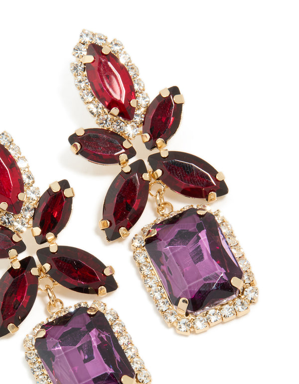 Macro view of statement gold red and purple diamante flower square drop earrings showcasing post detail view