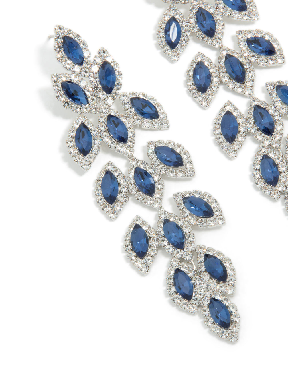 Beautifully designed statement drop earrings with royal blue diamantes in pear cut crafted from silver close up view