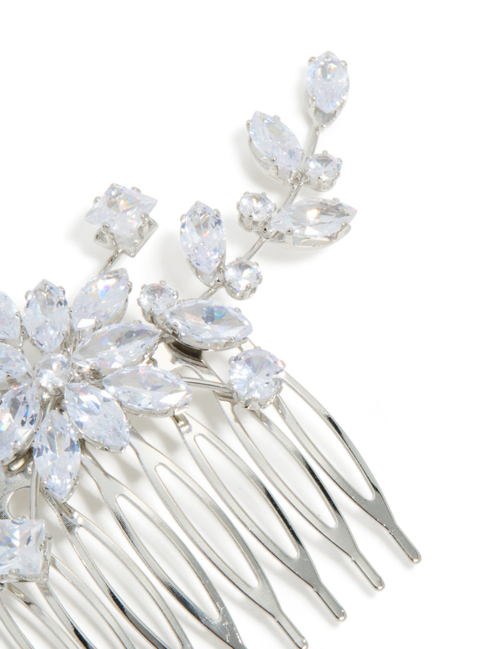 Featuring a beautiful floral pattern, this silver diamante statement hair comb is shown from the side view