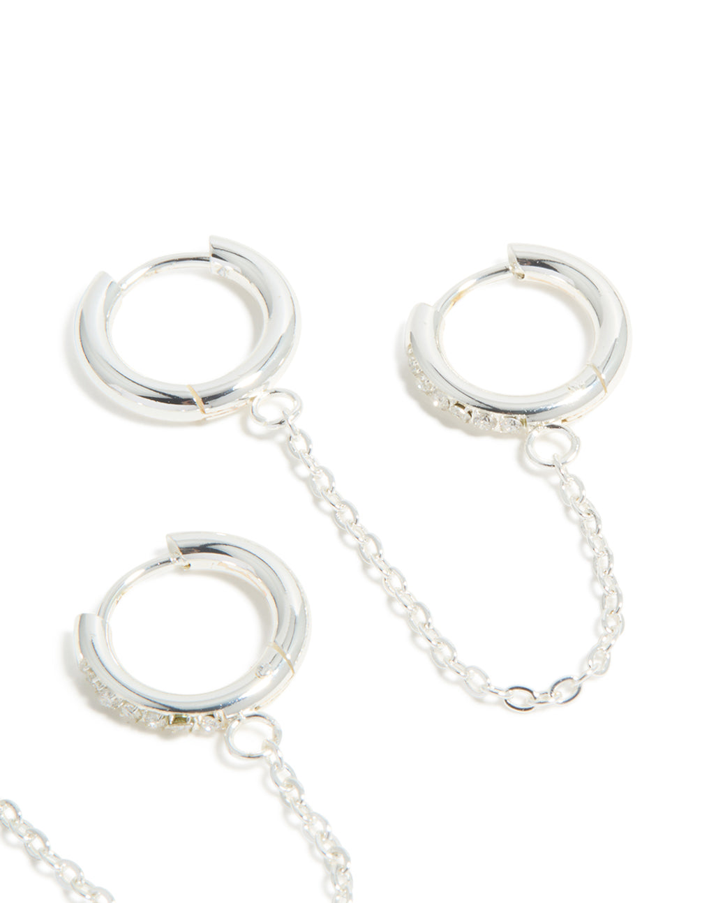 Presenting waterproof stainless steel cubic zirconia chain link huggie earrings in a 2-pack and silver finish post detail view