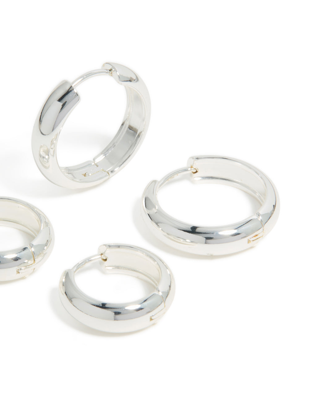 These elegant waterproof stainless steel thick, large and mini hoop earrings in a 2-pack with chunky round design in silver with a post detail view