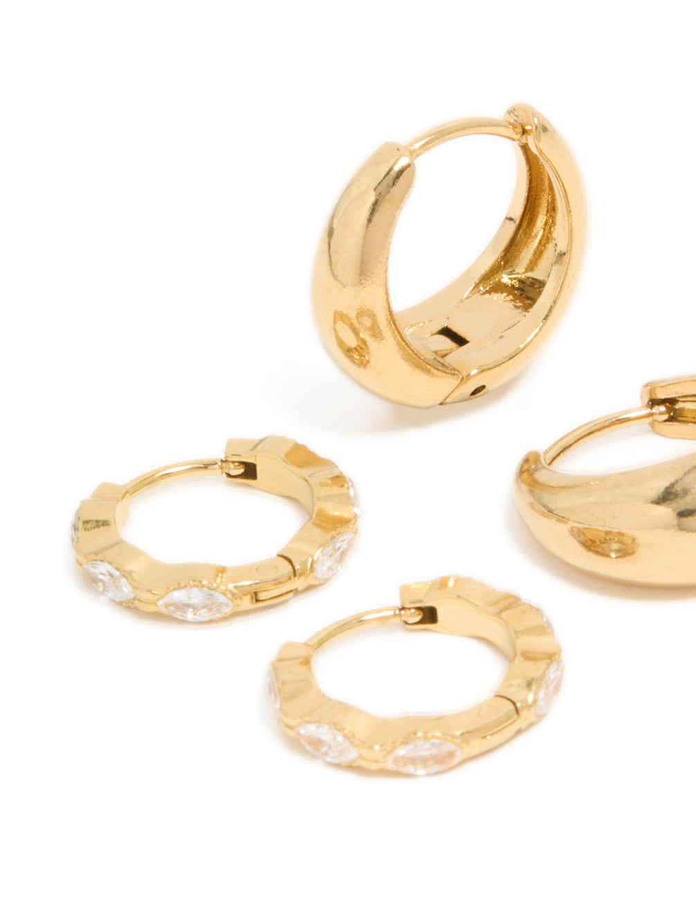 These waterproof gold plated stainless steel chunky oval cubic zirconia clicker earrings 2-pack reveal intricate huggie closure details in close up view