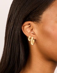 Featuring waterproof gold plated stainless steel thick, small and large hoop earrings in a 2-pack with chunky statement styling on ear view - link has visual effect only