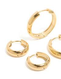 Designed with waterproof gold plated stainless steel , these thick, small and large hoop earrings in a 2-pack featuring chunky statement construction in a close up view - link has visual effect only