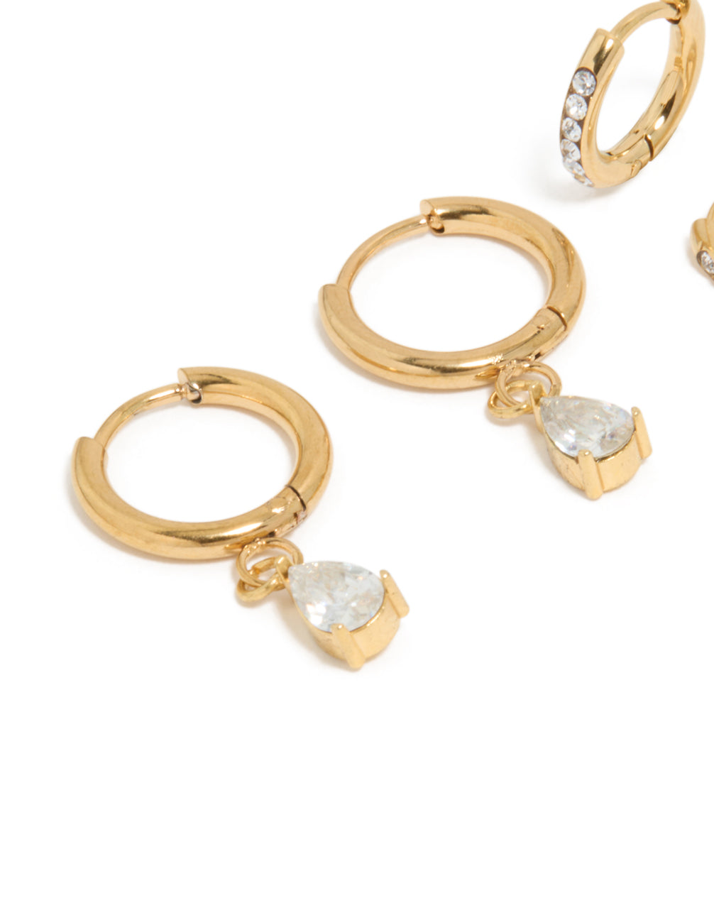 Crafted from waterproof gold plated stainless steel, these huggie earrings feature pear cut cubic zirconia in a 2-pack close up view