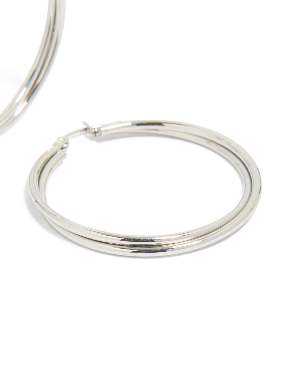 Highlighting surgical steel crossover hoop earrings in silver 40 MM close up view