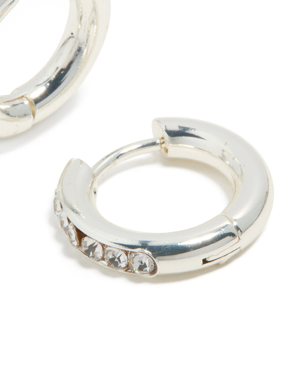 Highlighting the clicker closure detail of waterproof stainless steel round diamante hoop earrings in silver post detail view