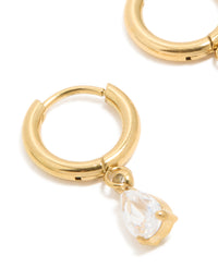Crafted from waterproof gold plated stainless steel, featuring pear cut cubic zirconia charm huggie earrings close up view - link has visual effect only