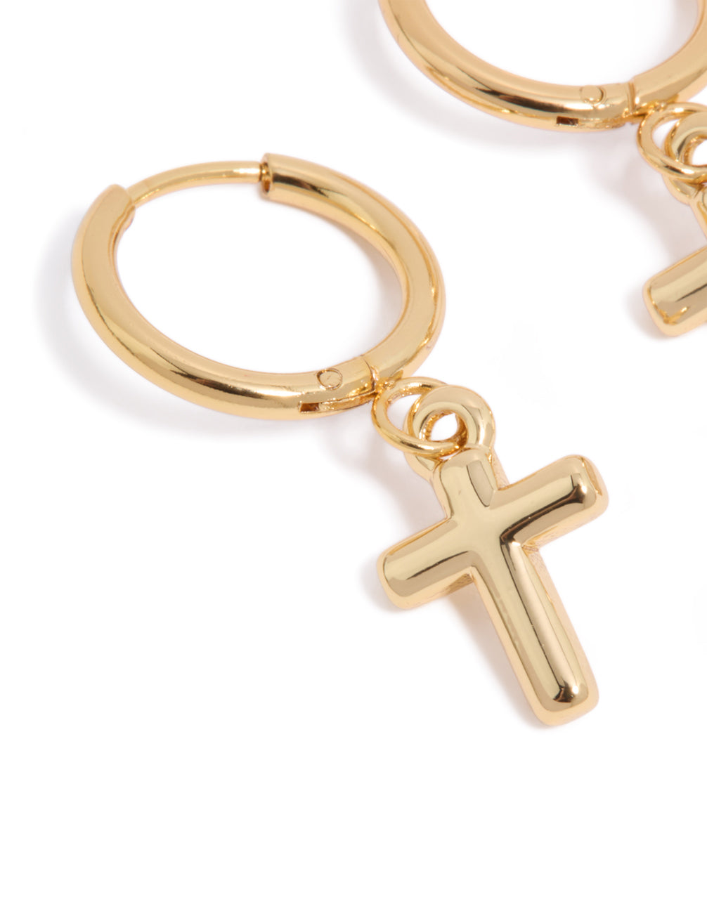 Designed with waterproof gold plated stainless steel are these finely crafted cross huggie earrings close up view