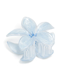 Discover this light blue clear edge frangipani flower claw clip featuring floral design front view - link has visual effect only