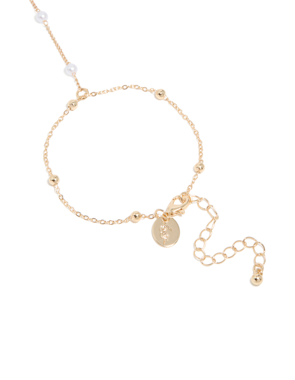 Featuring this dainty gold pearl and ball hand chain and adjustable lock in closure detail view