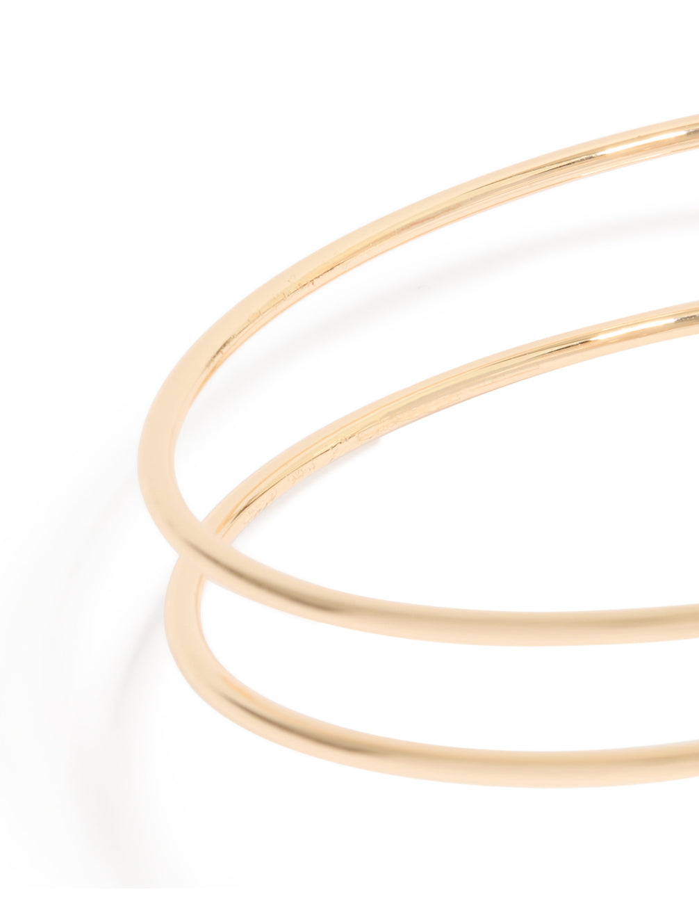 Featuring a gold swirl and brown stones arm cuff with statement design close up view