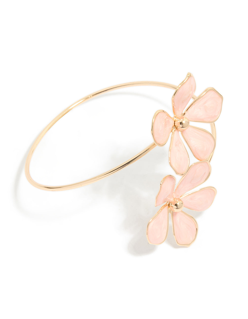 Showcasing a statement arm cuff featuring light pink enamel floral pattern in gold front view