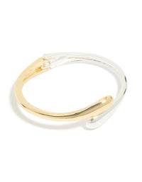 Showcasing a mixed metal plated wrap around bangle in gold and silver in front view - link has visual effect only