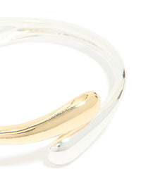 Featuring a mixed metal plated wrap around bangle in gold and silver in close up view - link has visual effect only