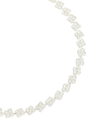Showcasing silver plated cubic zirconia multi flower necklace in statement style close up view - link has visual effect only
