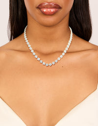 Elegantly designed silver plated cubic zirconia multi flower necklace in statement style on neck view - link has visual effect only