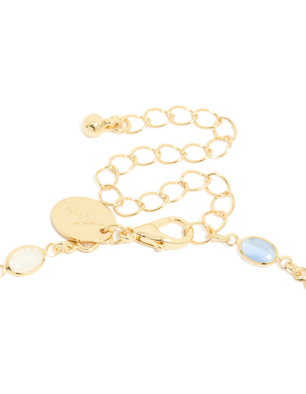 Highlighting the blue and white oval cubic zirconia set in the gold plated necklace clasp detail view
