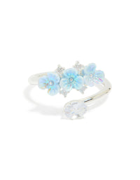 Featuring a silver plated triple flower wrap ring in powder blue and clear statement design front view - link has visual effect only