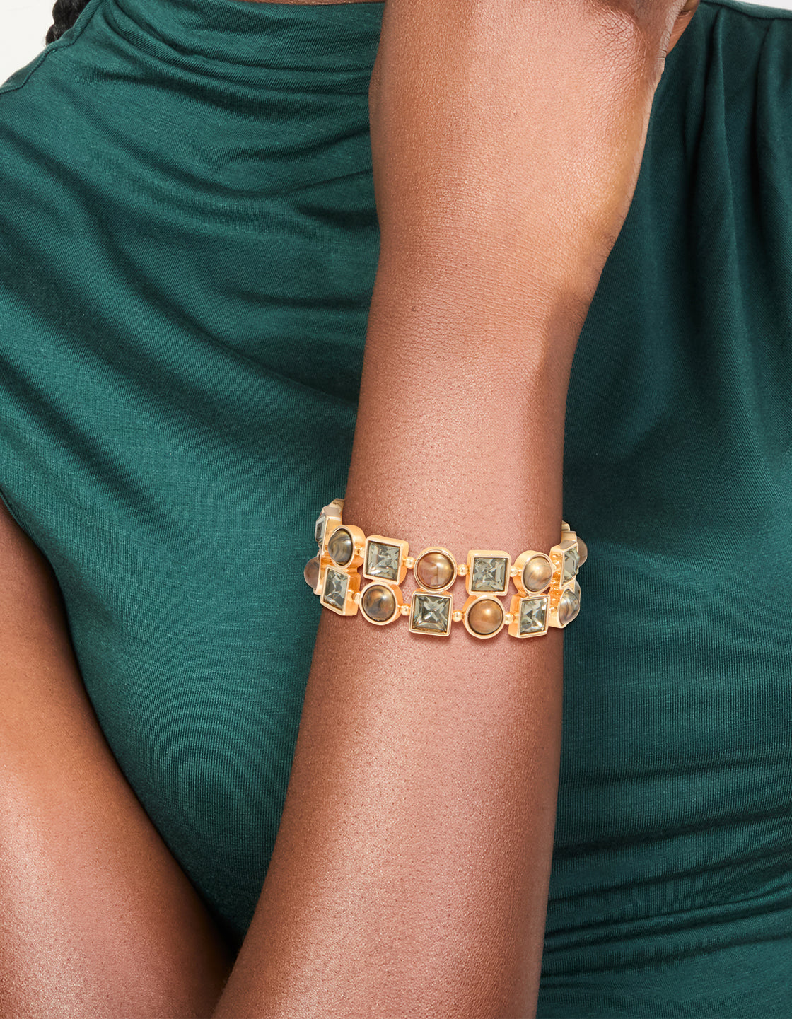 Featuring a gold brown acrylic and diamante stretch bracelet on wrist view