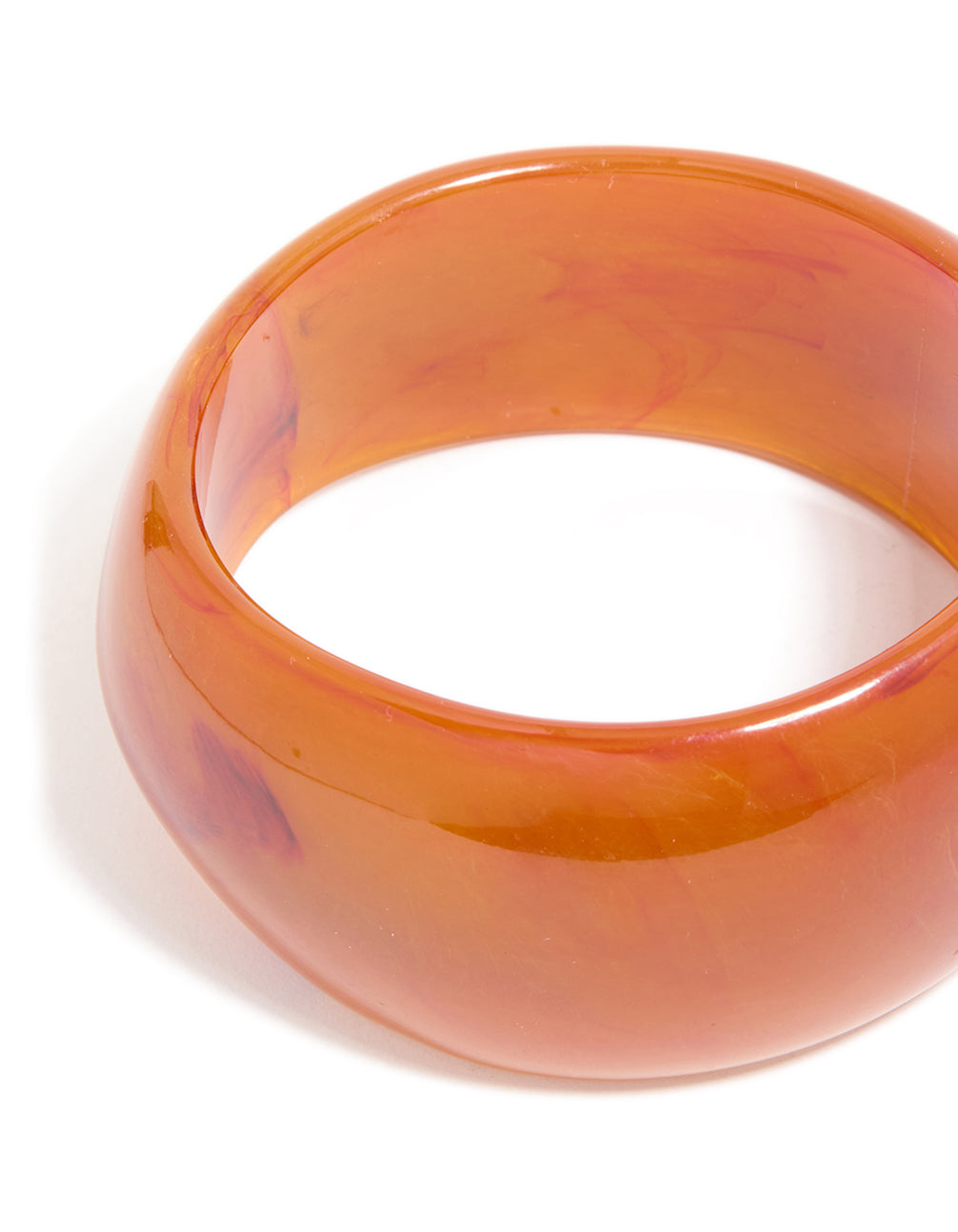 Featuring a 2-pack of gold and brown acrylic thick bangles with chunky statement design close up view