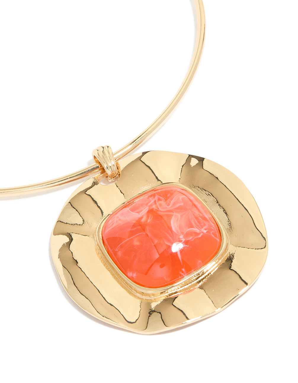 Featuring a gold orange pendant choker torque necklace with statement design close up view