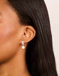Displaying rose gold plated cubic zirconia illusion pearl drop earrings with hoop closure in ivory on ear view - link has visual effect only