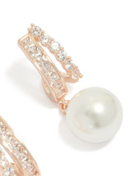 Highlighting rose gold plated cubic zirconia illusion pearl drop earrings with hoop closure in ivory showing craftsmanship post detail view - link has visual effect only