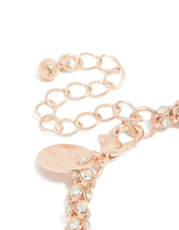 Crafted in rose gold plated material, is this diamante fireball bracelet closure detail view