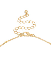 Displaying a gold plated brass necklace featuring evil eye charm with pearl pendant clasp detail view - link has visual effect only