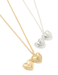 Beautifully crafted heart locket necklaces featuring cubic zirconia with silver and gold plated brass in a 2-pack close up view - link has visual effect only