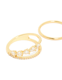 Showcasing gold plated cubic zirconia teardrop and band rings with crystal details in a dainty 3-pack close up view - link has visual effect only