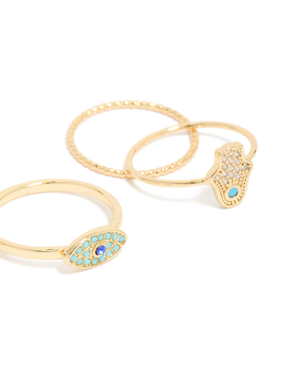 Crafted from gold plated cubic zirconia evil eye and hamsa hand rings 4-pack with celestial sun motifs, crystal accents, and statement style close up view