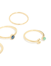Featuring gold plated celestial rings with blue cubic zirconia moon and star motifs in a 5-pack close up view - link has visual effect only