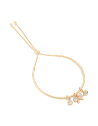Beautifully designed gold cubic zirconia bow charm toggle bracelet front view - link has visual effect only