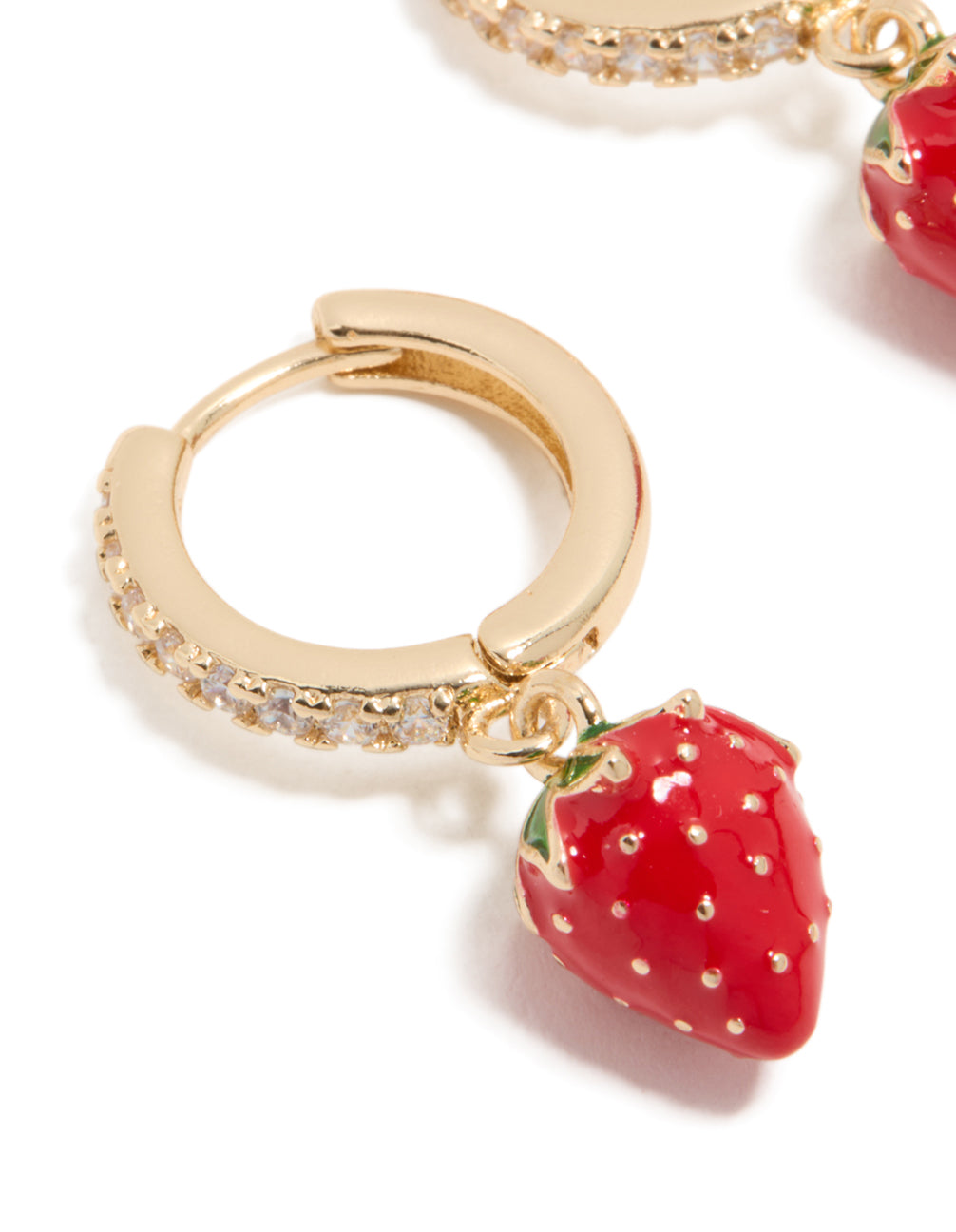 Crafted from gold cubic zirconia, these strawberry huggie earrings feature fruit accents in red, green, and white close up view