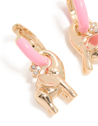 Showcasing huggie style elephant earrings crafted from enamel in light pink and gold close up view - link has visual effect only