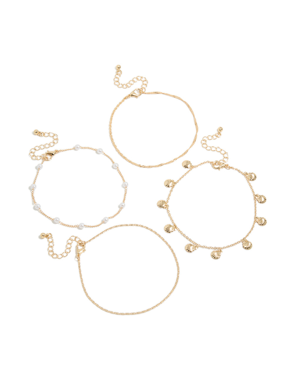Beautiful ocean charm featuring pearl and shell accents in gold anklets front view
