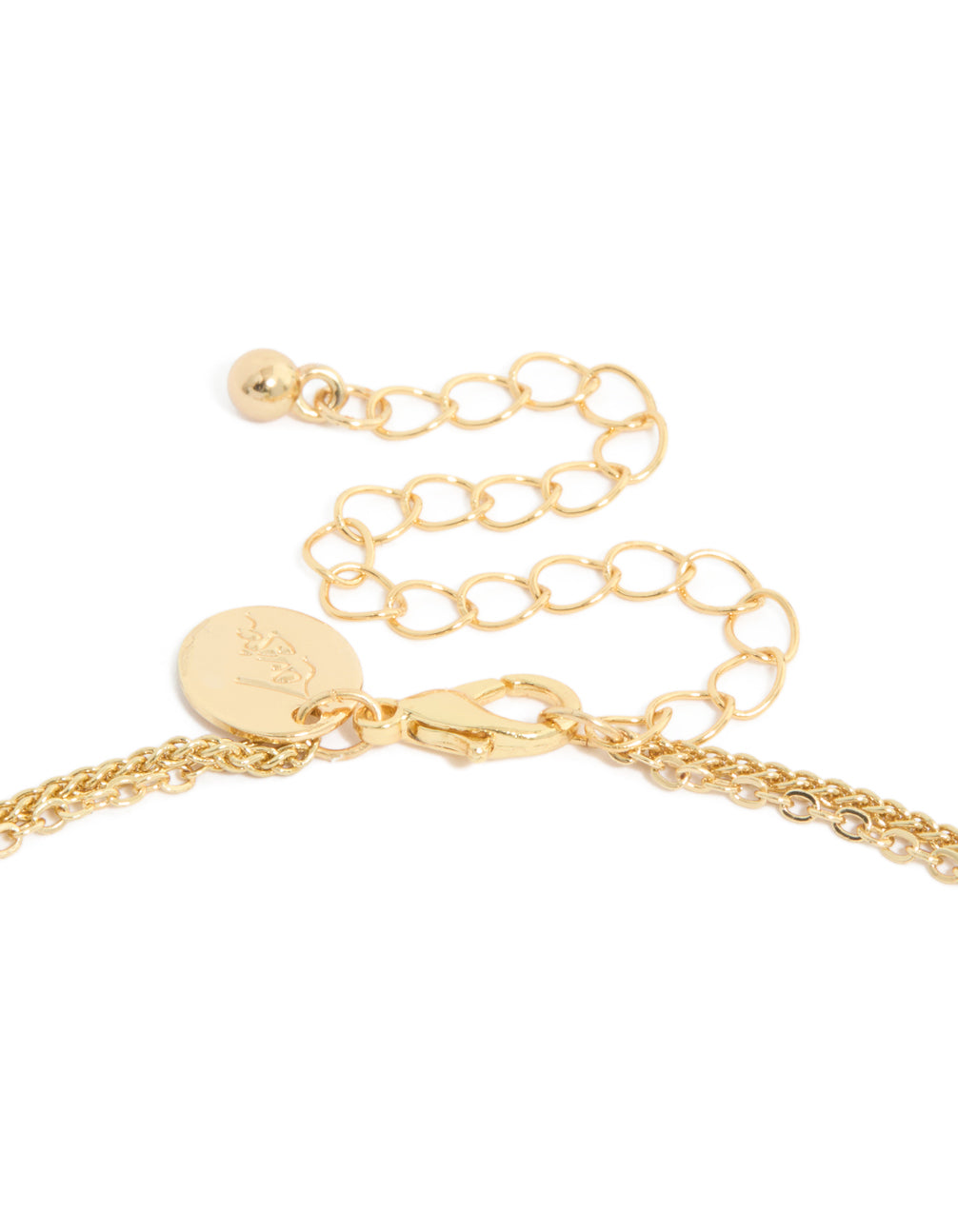 Highlighting a gold plated cubic zirconia layered necklace with infinity and cross clasp detail view
