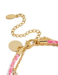 Highlighting waterproof stainless steel tennis bracelet with heart, beads, cubic zirconia, cord, and freshwater pearl accents in pink, white, and gold plated finish closure detail view - link has visual effect only