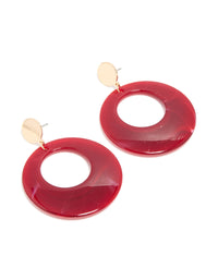 Showcasing statement drop earrings with marble pattern in crimson, maroon, and gold featuring front view - link has visual effect only