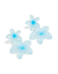 Showcasing blue acrylic frangipani flower drop earrings featuring in light cyan and aqua front view - link has visual effect only
