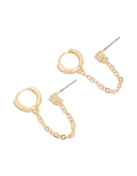 Showcasing statement gold diamante huggie and chain stud earrings front view - link has visual effect only