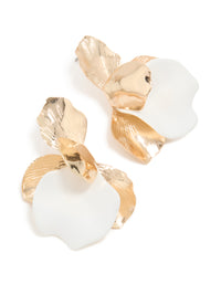 Showcasing statement stud earrings featuring floral design in gold and white front view - link has visual effect only