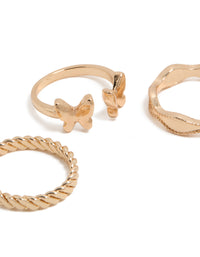 Showcasing gold butterfly and twisted rings in a 3-pack close up view - link has visual effect only