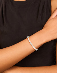 Showcasing a silver plated bezel diamante tennis bracelet on wrist view - link has visual effect only
