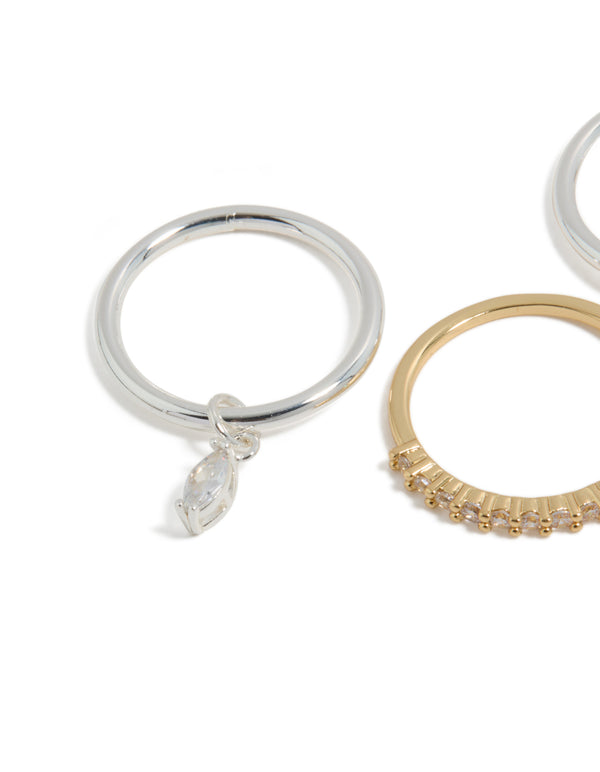 Discover a mixed metal plated organic cubic zirconia rings 4-pack featuring charm details in gold and silver close up view